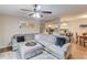 Open-concept living space featuring a comfortable sectional sofa and an open view into the kitchen at 405 Brighton Pt, Atlanta, GA 30328