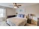 Comfortable primary bedroom featuring a ceiling fan, large windows, and a neutral color scheme at 405 Brighton Pt, Atlanta, GA 30328