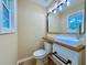 Chic bathroom with modern vanity, fixtures, and a square mirror at 413 Old Brock Rd, Rockmart, GA 30153