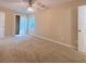 Spacious bedroom featuring a ceiling fan, carpet flooring and natural light at 413 Old Brock Rd, Rockmart, GA 30153