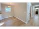 Bright dining area with hardwood floors and natural light streaming through the window at 413 Old Brock Rd, Rockmart, GA 30153