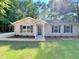 Charming single-story home featuring a well-maintained lawn and inviting front entrance at 413 Old Brock Rd, Rockmart, GA 30153