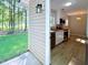 Bright kitchen with white cabinets, stainless steel appliances, and stylish vinyl flooring at 413 Old Brock Rd, Rockmart, GA 30153
