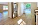 Kitchen features stainless steel refrigerator, white cabinets, and stylish wood-look flooring at 413 Old Brock Rd, Rockmart, GA 30153