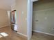 Open view of the kitchen featuring stainless steel refrigerator and a laundry closet at 413 Old Brock Rd, Rockmart, GA 30153