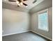 Bedroom featuring a ceiling fan, natural light and neutral carpeting at 4185 Lenox Park Dr, Buford, GA 30519