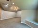 Spacious upstairs bonus room with multiple ceiling fans, recessed lighting, and neutral carpeting at 4185 Lenox Park Dr, Buford, GA 30519