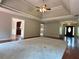 Spacious living area with trey ceilings, open floor plan, and hardwood floors at 4185 Lenox Park Dr, Buford, GA 30519