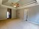 Large main bedroom with neutral carpet, and doorways to other rooms in the house at 4185 Lenox Park Dr, Buford, GA 30519