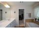 Bright bathroom with dual sinks, a soaking tub and plenty of storage at 574 Friars Head Dr, Suwanee, GA 30024