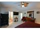 Spacious bedroom offers a ceiling fan, carpeted floors, natural light, and room to relax at 574 Friars Head Dr, Suwanee, GA 30024