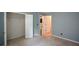 Bedroom featuring an open closet and an adjoining bathroom with tile detail at 574 Friars Head Dr, Suwanee, GA 30024