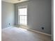 Comfortable bedroom featuring neutral paint, carpeted floors and natural light at 574 Friars Head Dr, Suwanee, GA 30024