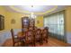 Bright dining room with hardwood floors, chandelier, and classic decor at 574 Friars Head Dr, Suwanee, GA 30024