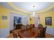 Elegant dining room featuring a chandelier, stylish furniture, and hardwood floors at 574 Friars Head Dr, Suwanee, GA 30024