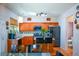Bright kitchen featuring stainless steel appliances, breakfast bar, and seamless flow into adjacent spaces at 574 Friars Head Dr, Suwanee, GA 30024