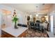Open concept living space with kitchen and dining area at 574 Friars Head Dr, Suwanee, GA 30024