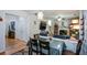 Open concept living space with fireplace and hardwood floors, seamlessly connected to the dining area at 574 Friars Head Dr, Suwanee, GA 30024