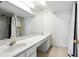 Bright bathroom featuring dual sinks, a long vanity, and shower with a glass door at 6851 Roswell Rd # F5, Sandy Springs, GA 30328