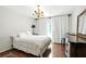Cozy bedroom featuring gleaming hardwood floors and bright natural light at 6851 Roswell Rd # F5, Sandy Springs, GA 30328