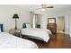 Bedroom featuring hardwood floors, ceiling fan, and natural light at 6851 Roswell Rd # F5, Sandy Springs, GA 30328
