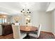 Traditional dining room featuring a round table, chandelier, and decorative rug at 6851 Roswell Rd # F5, Sandy Springs, GA 30328