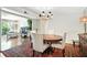 Elegant dining room with natural light, chandelier, and access to the living area at 6851 Roswell Rd # F5, Sandy Springs, GA 30328