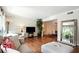 Bright living room with hardwood floors connecting to the dining area at 6851 Roswell Rd # F5, Sandy Springs, GA 30328