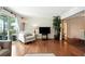 Comfortable living room featuring hardwood floors and plenty of natural light at 6851 Roswell Rd # F5, Sandy Springs, GA 30328