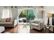 Cozy living room featuring hardwood floors and access to an outdoor balcony at 6851 Roswell Rd # F5, Sandy Springs, GA 30328