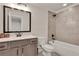 Beautiful bathroom with updated vanity, framed mirror and shower-tub combo at 1611 Alcovy Station Rd, Covington, GA 30014