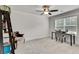 Bright bedroom features a ceiling fan, large window with blinds and an elegant chair at 1611 Alcovy Station Rd, Covington, GA 30014