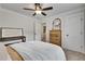 Bright bedroom with a ceiling fan and hardwood dresser at 1611 Alcovy Station Rd, Covington, GA 30014