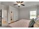 Cozy bedroom with ceiling fan and neutral tones at 1611 Alcovy Station Rd, Covington, GA 30014
