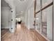Open entryway featuring hardwood floors leading into living spaces and a study, visible through a glass door at 1611 Alcovy Station Rd, Covington, GA 30014