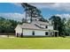Picture of the two-story exterior of the house with a spacious lawn at 1611 Alcovy Station Rd, Covington, GA 30014