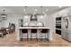 Spacious kitchen with an island, pendant lights, stainless steel appliances, and an adjacent dining area at 1611 Alcovy Station Rd, Covington, GA 30014