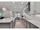 Beautiful kitchen with a large island, white countertops, and stainless steel appliances at 1611 Alcovy Station Rd, Covington, GA 30014