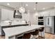Modern kitchen features a large island with seating, stainless appliances, and ample counter space at 1611 Alcovy Station Rd, Covington, GA 30014