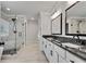 Beautiful bathroom with double vanity, granite countertops, and a glass-enclosed shower at 1611 Alcovy Station Rd, Covington, GA 30014