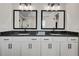 Bathroom featuring double sinks with granite countertops, white cabinets, and a glass-enclosed shower at 1611 Alcovy Station Rd, Covington, GA 30014