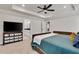 Spacious main bedroom with a tray ceiling, large bed, and access to an en-suite bathroom at 1611 Alcovy Station Rd, Covington, GA 30014