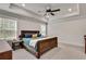 Serene main bedroom featuring a tray ceiling, neutral color scheme, and ample natural light at 1611 Alcovy Station Rd, Covington, GA 30014