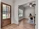 Bright office space with a view, wood floors, and rustic desk setup, accessed through a stylish glass door at 1611 Alcovy Station Rd, Covington, GA 30014