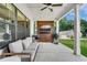 Covered patio features a TV, grill, and comfortable seating area at 1611 Alcovy Station Rd, Covington, GA 30014