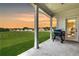Covered patio with picturesque views and outdoor cooking setup at 1611 Alcovy Station Rd, Covington, GA 30014
