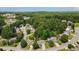 Wide aerial shot showcasing a residential neighborhood with tree-lined streets and single-Gathering homes at 454 Pine Bluff Dr, Dallas, GA 30157