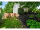 Landscaped yard featuring dark mulch, well manicured bushes and mature trees and shrubs at 454 Pine Bluff Dr, Dallas, GA 30157