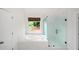 Bright bathroom features a soaking tub and a glass enclosed shower at 454 Pine Bluff Dr, Dallas, GA 30157