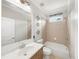Bright bathroom features a single sink vanity, large mirror, and tiled tub-shower combo at 454 Pine Bluff Dr, Dallas, GA 30157
